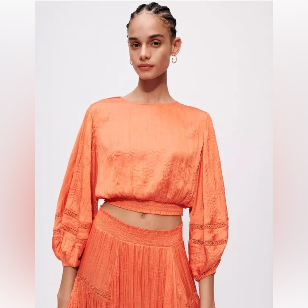 Maje crinkle orange top and skirt set. Skirt was adjusted to fit size 0-1.
